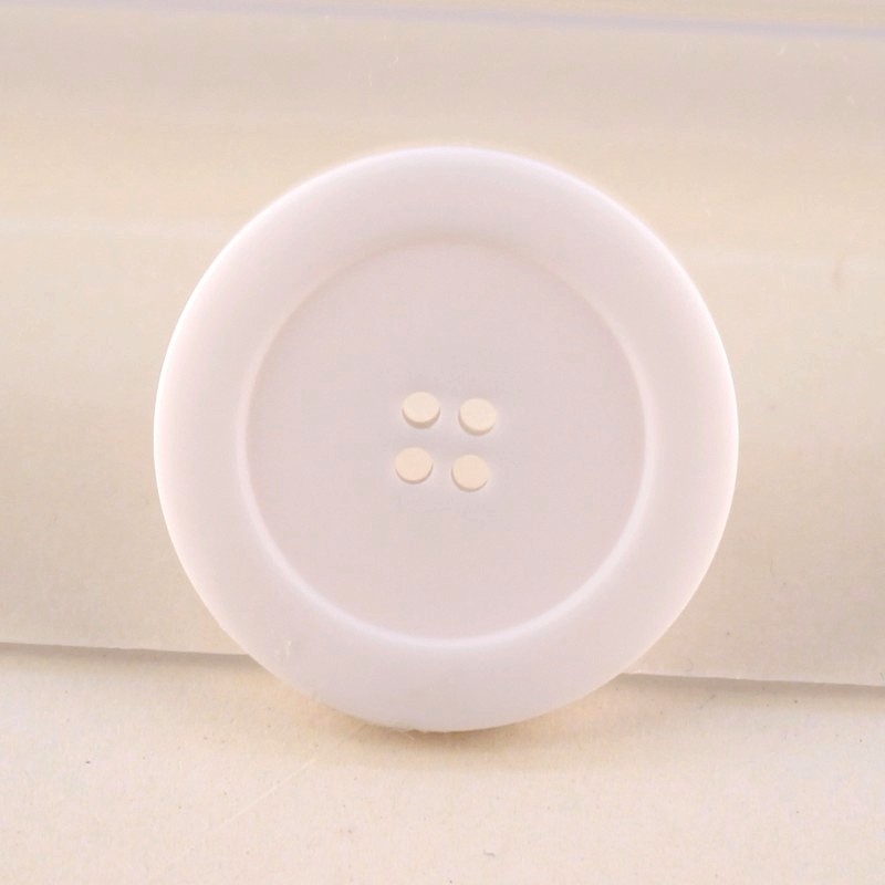 White haberdashery button